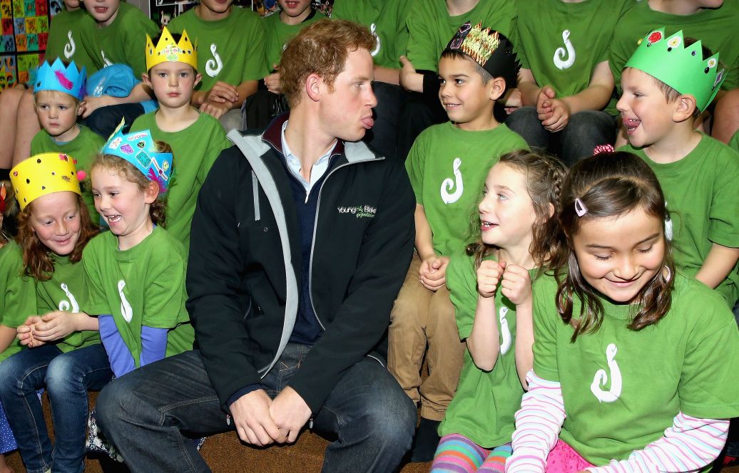 Prince Harry sits with pupils at Halfmoon Bay School in Oban as he leaves / Photo: Getty Images