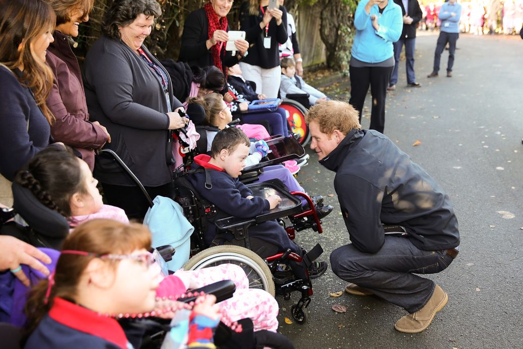 Prince Harry meets local school children outside Odyssey House / Photo: Getty Images