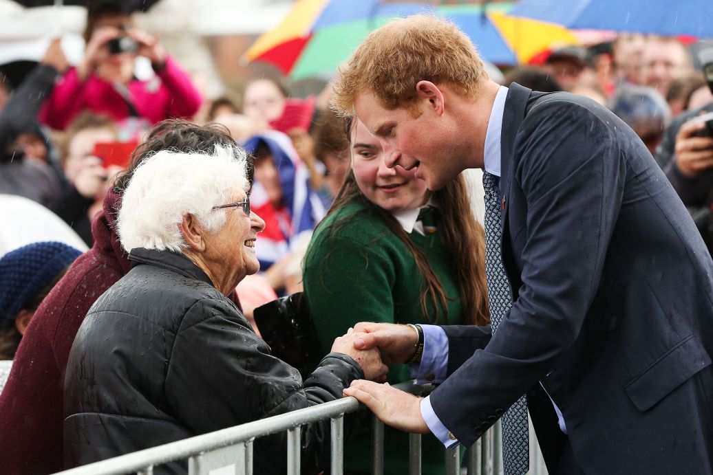 Prince Harry greets a fan during a public walkabout at Wanganui War Memorial Centre / Photo: Getty Images