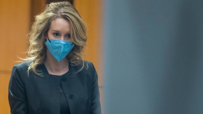 Elizabeth Holmes walks into federal court in San Jose, California, before being convicted on four counts of fraud and conspiracy. Photo / AP