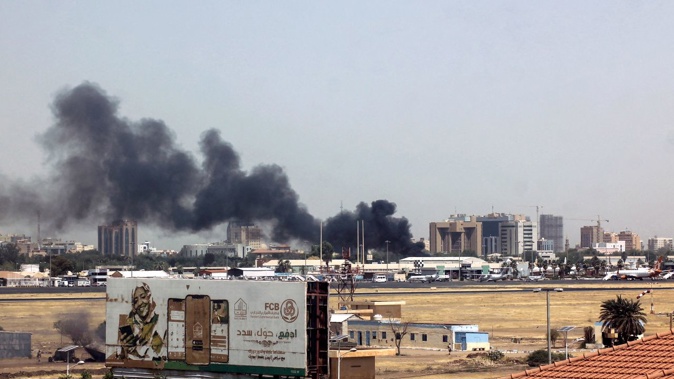 Heavy smoke bellows above buildings in the vicinity of the Khartoum's airport on April 15, 2023, amid clashes in the Sudanese capital. AFP/Getty Images