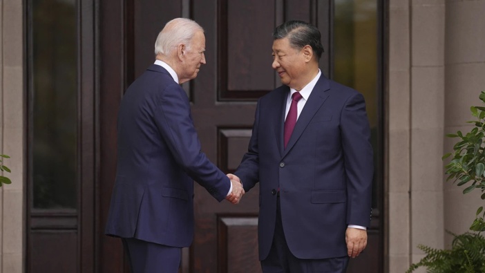 President Joe Biden greets Xi Jinping. (Doug Mills/The New York Times via AP, Pool)