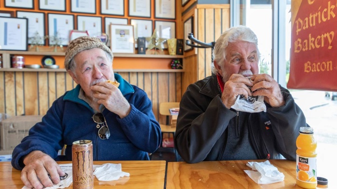 Don Shatford (left) and Doug Brown enjoying a bite to eat at Patrick's Pies in Bethlehem after Patrick Lam won Bakels NZ supreme award for one of his pies. Photo / Alex Cairns