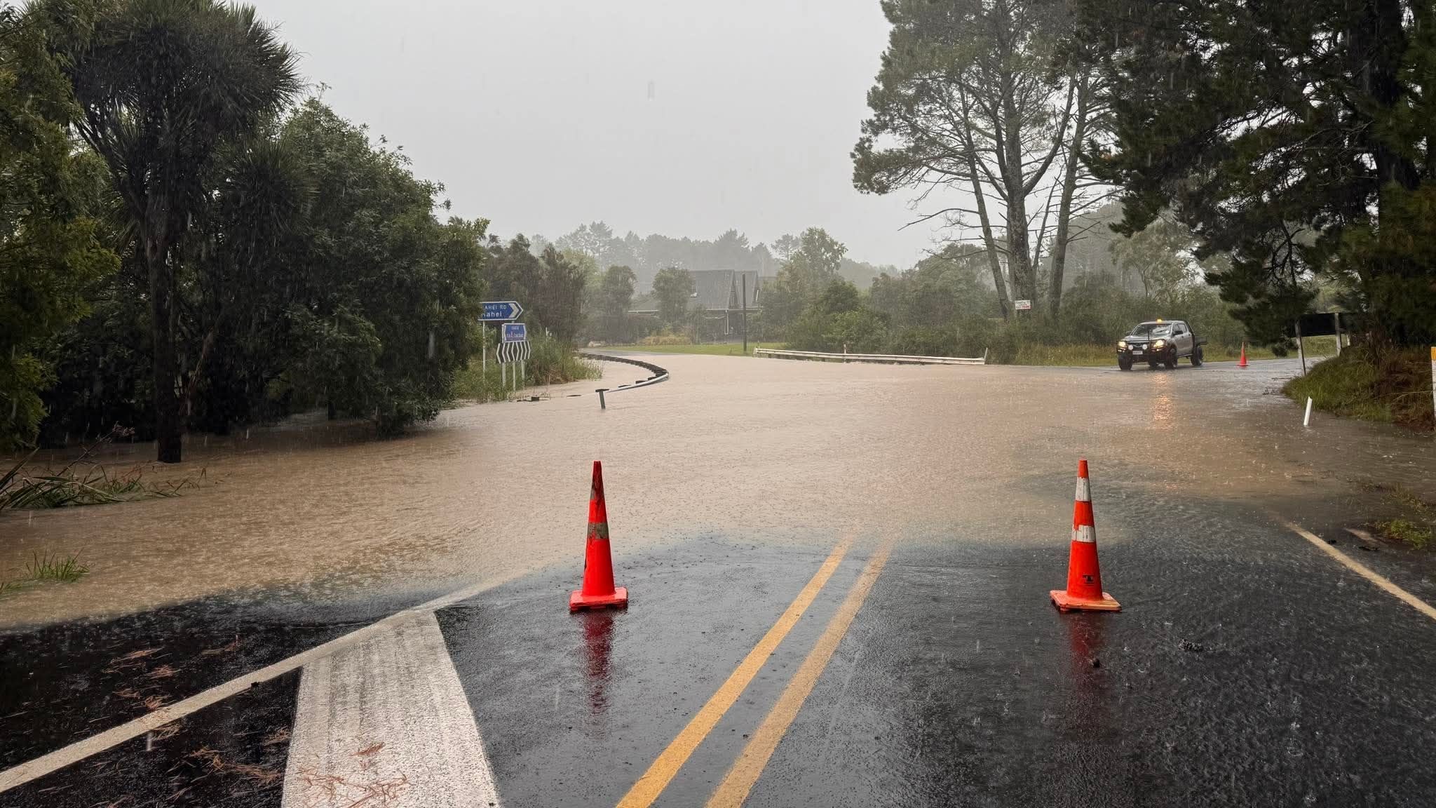 Man missing after car swept down Auckland river, holidaymakers urged to move to higher ground