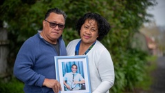 Rev Dr Matagi Vilitama and Joanna Matagi hold a photo of their 25-year-old son Tofi Matagi, who died after an assault at a Mt Roskill bar on August 31. Photo / Michael Craig