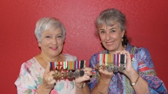 Suzanne Roberts (left) and Joanne Ruscoe with their fathers' war medals. Photo / David Haxton