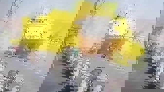 This photo taken from CCTV video broadcasted by Al-Mamlaka TV shows a chlorine gas explosion after it fell off a crane in the port of Aqaba, Jordan. Photo / AP