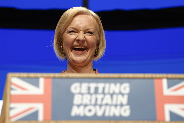 Britain's Prime Minister Liz Truss laughs during her speech at the Conservative Party conference at the ICC in Birmingham. Photo / AP