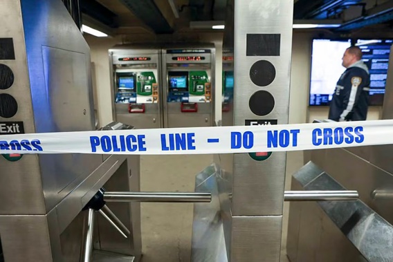 New York Police walk through the Mount Eden subway station while investigating a shooting. Photo / AP
