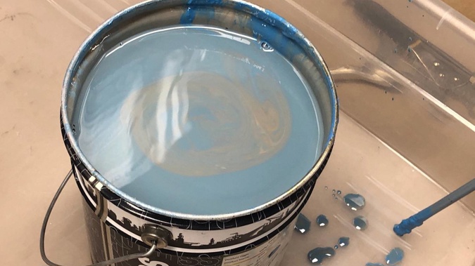 An Auckland man has been arrested after 16kg of methamphetamine was found in buckets of blue liquid resembling paint. Photo / Supplied