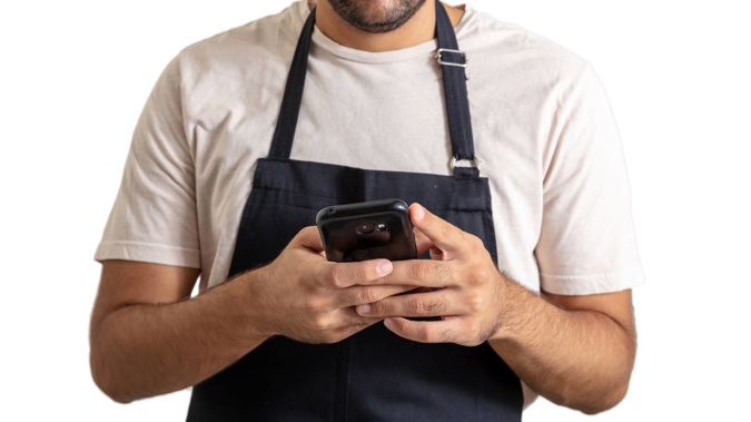 The waiter used his phone to film patrons in the toilet. (Photo / 123RF)