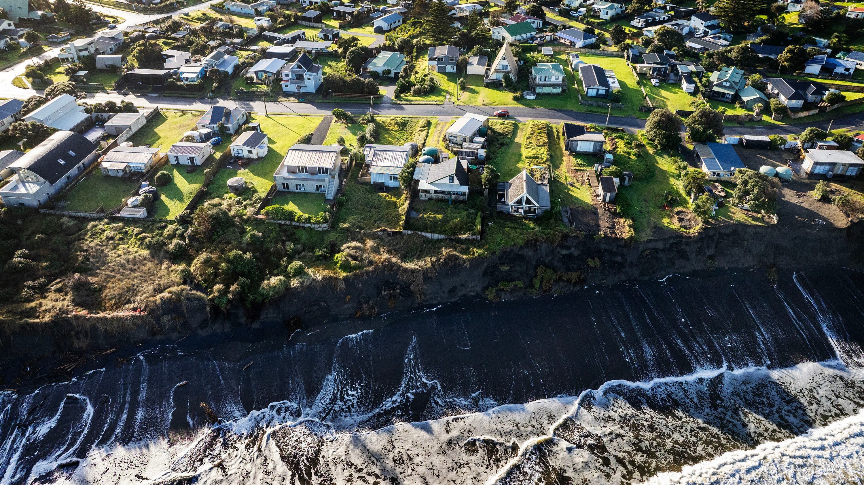 Coastal erosion at Port Waikato's Sunset Beach has put more houses in imminent danger. Photo / Mike Scott