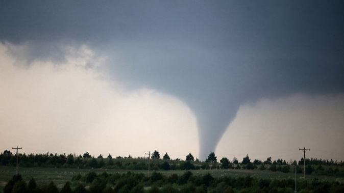 The EF2 tornado, with winds over 289km/h, caused no structural damage, only affecting trees and power poles. Photo / Getty Images