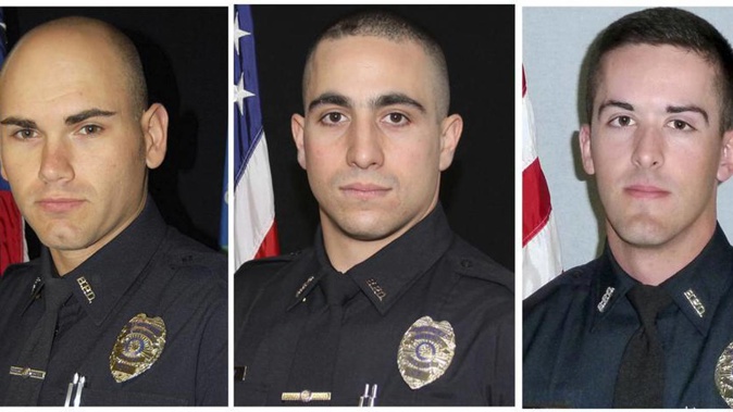 Photo / FileSergeant Dustin Demonte, Officer Alex Hamzy and Officer Alec Iurato of Bristol Police Department. Photo / AP