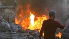 People and rescuers tried to put out a fire at the site of an Israeli airstrike that targeted a densely populated neighbourhood in Lebanon's eastern city of Baalbek on November 6, 2024. Photo / AFP