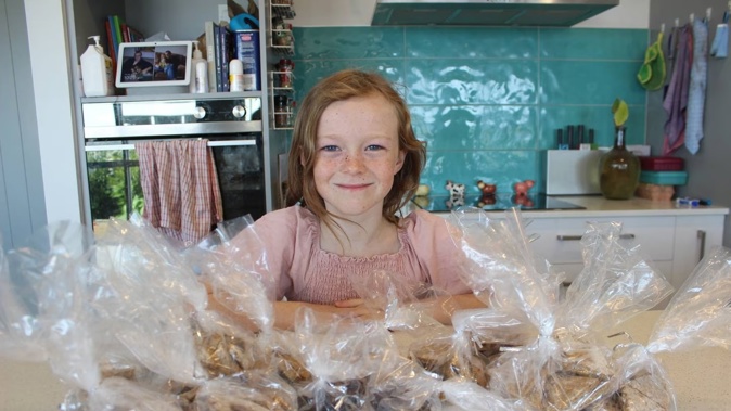 Erin Long with bags of homemade dog treats. Photo / David Haxton