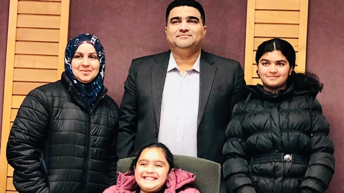 Syed Khurram Iqbal, here with wife Syeda Narjis Khurram and daughters Syeda Raneeya Batool and Syeda Waneeya Batool Naqvi, is distraught at delays and the possible loss of a $175,000 deposit for an Auckland home.