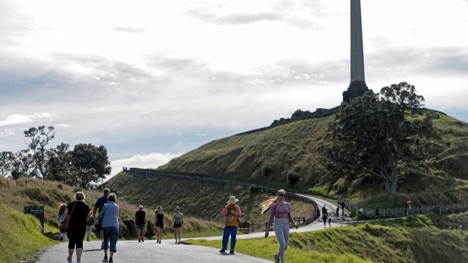 Cloudy but fine weather on Maungakiekie / One Tree Hill as people take an early morning walk on a long Easter weekend. Photo / Alex Burton