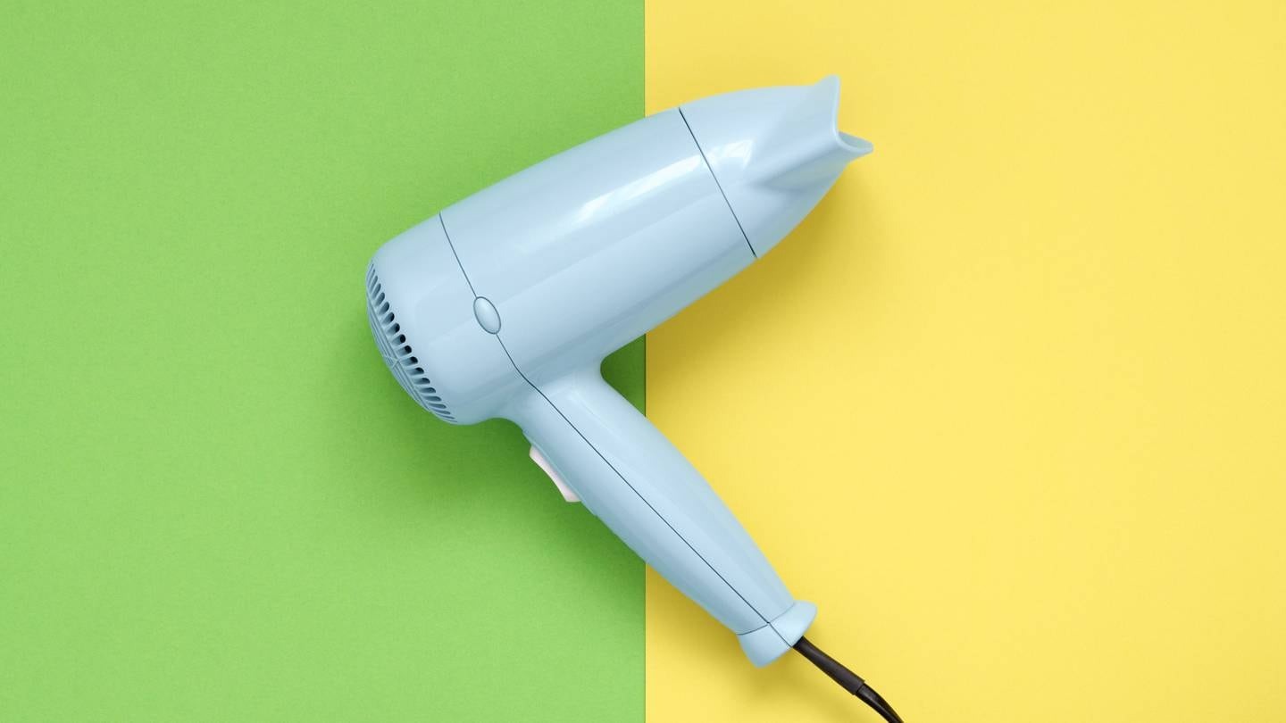 A Perth hotel has come under fire after it charged a customer $1400 when she used a common brand of hair dryer. Photo / 123rf