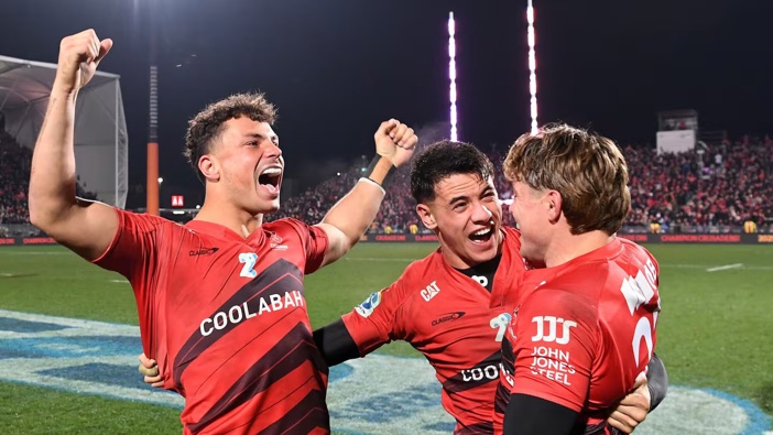 Macca Springer (from left), Rivez Reihana and James O'Connor celebrate the Crusaders' win over the Chiefs. Photo / Getty Images