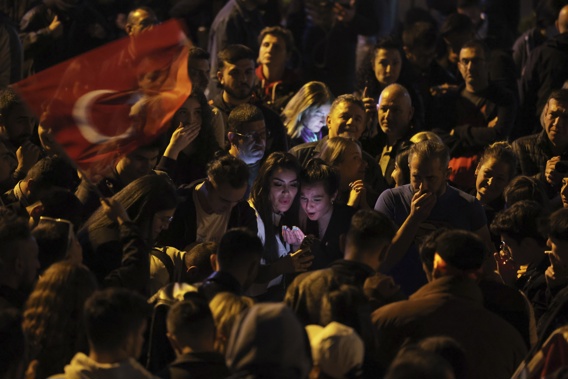 Supporters of Republican People's Party use their cellphones to watch the election results outside the headquarters of CHP, in Ankara, Turkey, Sunday, May 14, 2023. More than 64 million people, including 3.4 million overseas voters, were eligible to vote. Photo / AP