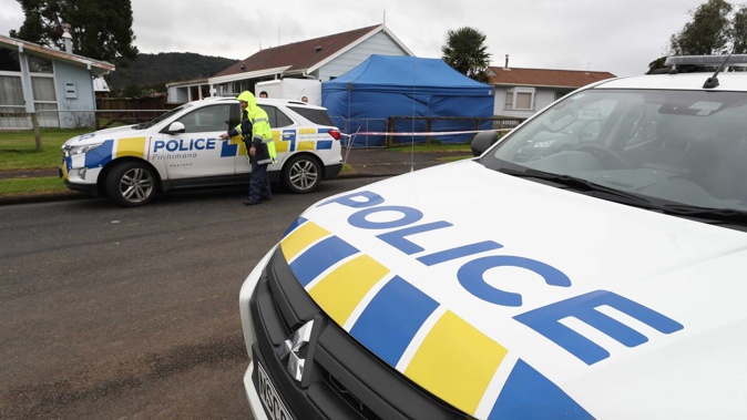 Police search a property in Taraire St in relation to the investigation into the death of Linda Woods
