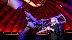 Victoria Travers, Chief Executive Stardome Observatory and Planetarium with the WEB Zeiss telescope. Photo / Michael Craig