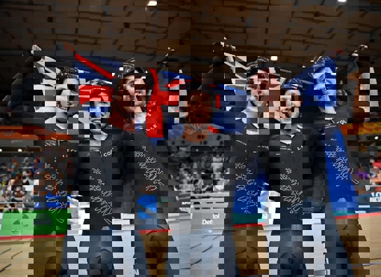 Corbin Strong (C) celebrates gold with teammates, Campbell Stewart (L) and George Jackson (R). Photo / Getty