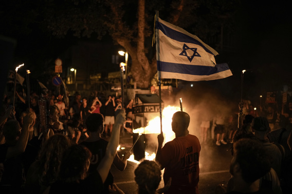 People protest against Israeli Prime Minister Benjamin Netanyahu's government and call for the release of hostages held in the Gaza Strip by the Hamas militant group, in Tel Aviv, Israel, Saturday, June 22, 2024. (AP Photo/Leo Correa)
