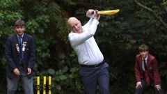 Prime Minister Christopher Luxon gets in a bit of a tangle as he plays a shot through the off-side. Photo / Hagen Hopkins