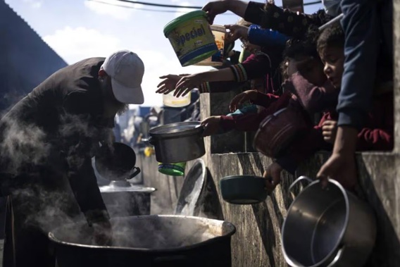 Palestinians line up for a free meal in Rafah, Gaza Strip. Photo / AP