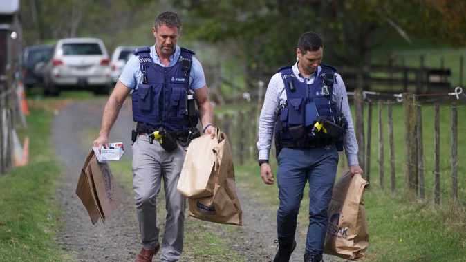 Police at the Anzac Valley Road property in West Auckland after the mysterious deaths of two people. Photo / Jason Oxenham