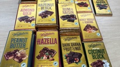 Some 50 blocks of Whittaker's chocolate allegedly stolen from a supermarket were found during a raid of an Auckland dairy. Photo / New Zealand Police