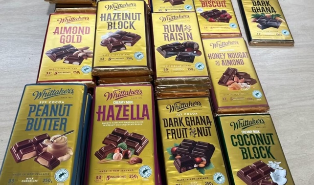 Some 50 blocks of Whittaker's chocolate allegedly stolen from a supermarket were found during a raid of an Auckland dairy. Photo / New Zealand Police