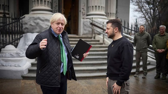 Ukrainian President Volodymyr Zelenskyy (right) and former British Prime Minister Boris Johnson talk during their meeting in Kyiv. Photo / AP