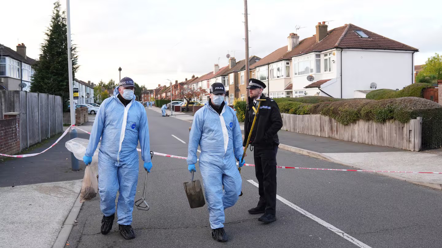 Police officers in Midhurst Gardens in Uxbridge, west London, after a man was stabbed to death and two other people, including a 14-year-old boy, were injured today. Photo / Getty Images