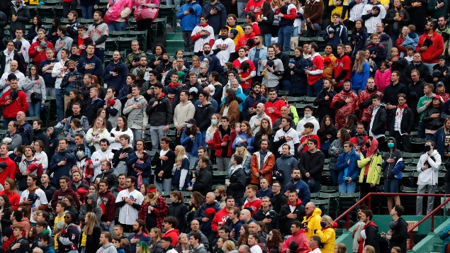 Fans stand for the national anthem before a baseball game between the Boston Red Sox and the Miami Marlins, after the easing of restrictions. Photo / AP