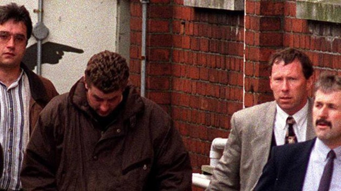 Gareth Smither (wearing brown) leaving court in 1997. Photo / ODT