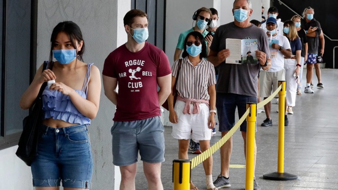 People wait in line at a Covid-19 testing station in Sydney's northern beaches on December 21 last year. (Photo / News Corp)