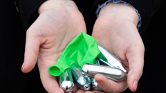 Nitrous oxide canisters and a balloon found on the side of the road in a Rotorua suburb. Photo / Andrew Warner