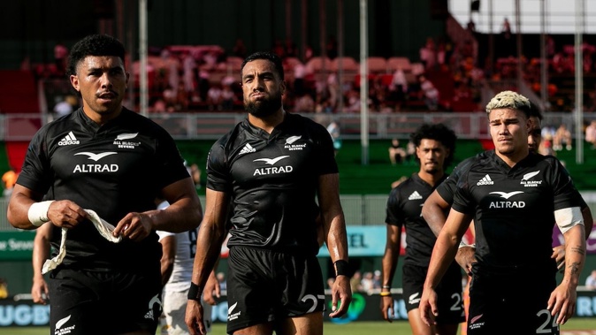 All Blacks Sevens players are dejected after losing to Argentina in the Dubai Sevens semifinals. Photosport