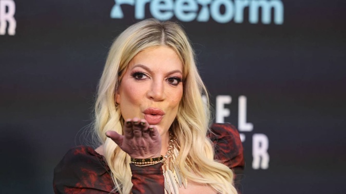 Tori Spelling has gone from growing up in a lavish Hollywood mansion to staying in a string of motels and trailer parks. Photo / Getty Images