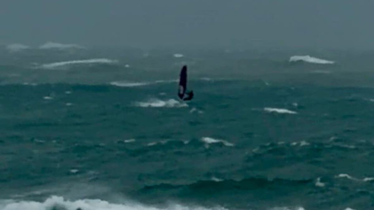 Live: Authorities fuming as windsurfer goes for a cyclone sail