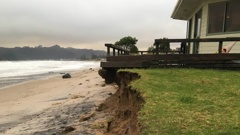The devastating effect of the storm surges was made clear as dawn rose over the Mercury Bay Boating Club in Whitianga. Photo / Lynley Ward
