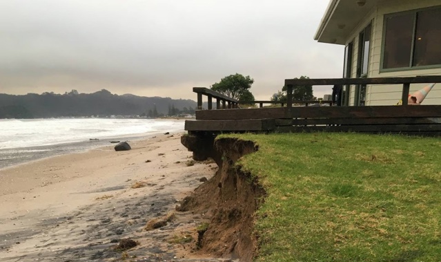 The devastating effect of the storm surges was made clear as dawn rose over the Mercury Bay Boating Club in Whitianga. Photo / Lynley Ward