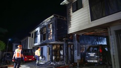 Fire crews at the blaze on Walmsley Rd, Favona. (Photo / Hayden Woodward)