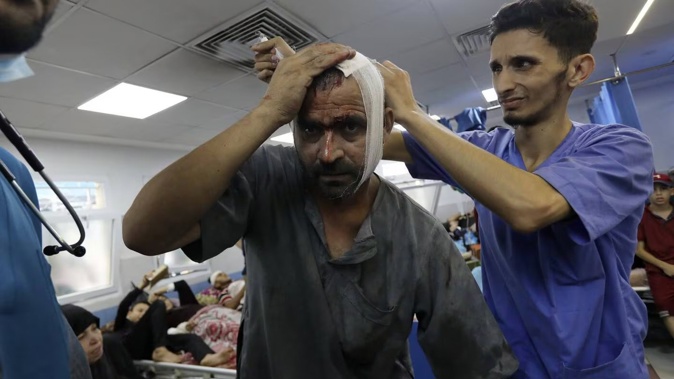 An injured Palestinian man receives treatment at the al-Shifa hospital, following Israeli airstrikes on Gaza City, earlier this month. Photo / AP