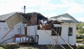 A property that was badly damaged in last October's storm. Photo / RNZ, Katie Todd