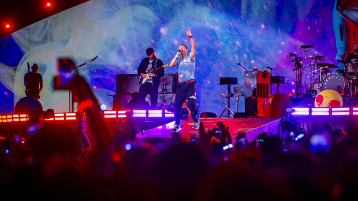 Chris Martin (R) and Jonny Buckland (L) of the group Coldplay Performs at Stadio Olimpico on July 12, 2024 in Rome, Italy. (Photo by Roberto Panucci - Corbis/Corbis via Getty Images)