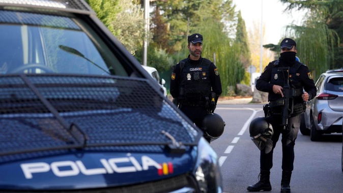 Police officers stand guard as they cordon off the area next to the Ukrainian embassy in Madrid, Spain, on Wednesday. Photo / AP